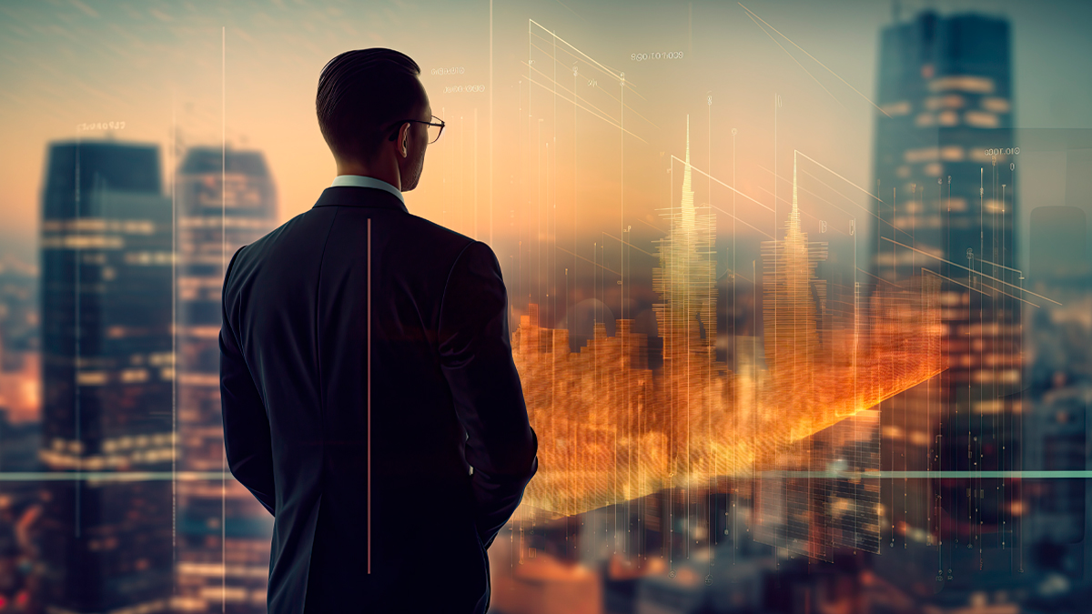Executivo analisando projeções de mercado e gráficos digitais sobre a cidade ao pôr do sol.